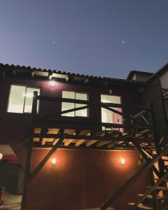 a building with lights on the side of it at Recanto das Pedras Floripa in Florianópolis