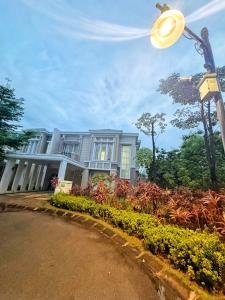 a house with a street light in front of it at 4 Bedrooms Big Holiday House with Pool by PlayHouse at Batam Center in Batam Center