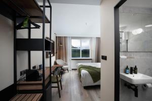 Postel nebo postele na pokoji v ubytování Hotel Klaustur