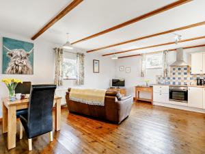 a living room with a couch and a table at 1 Bed in Sennen GIDUP in St Just