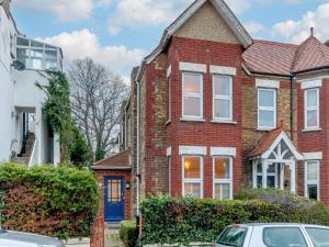 a red brick house with a blue door at 2 Bed in Broadstairs 89889 in Broadstairs