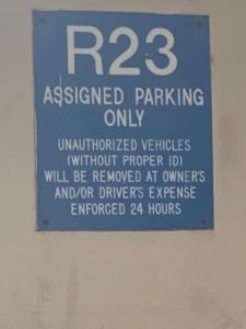 a sign on the wall of a parking garage at Royal Aloha Waikiki Beach in Honolulu