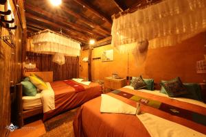 Gulta vai gultas numurā naktsmītnē Dinh Đá H'Mông - Karsterly Rock Lodge