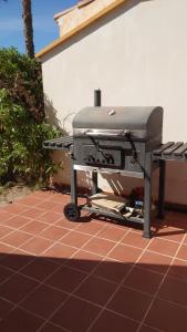 a bbq grill sitting on top of a patio at Villas Alandalus in Vera