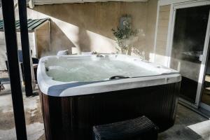 a large bath tub with snow on the top of it at New! Mountain Retreat HotTub, Fire Pit, Pool Table in Thornton