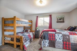 a bedroom with two beds and a bunk bed at Pet Friendly Millcreek Home Close to Downtown/Mtns in Salt Lake City