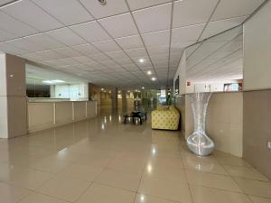 an empty hallway in an office building with a large ceiling at Terrazas del Duque II Hideaway in Adeje +29 photos