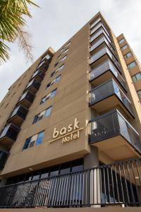 a building with the namebush hotel on it at Bask Hotel at Big Rock Landing in Morehead City