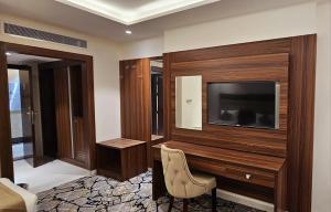 TV a/nebo společenská místnost v ubytování EWG Al Mashaer Hotel