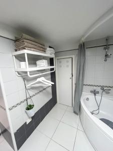 a bathroom with a white tub and a sink at Casa Della Felicità in Naples +22 photos