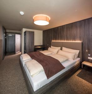 Postel nebo postele na pokoji v ubytování MYHOTEL München Olching