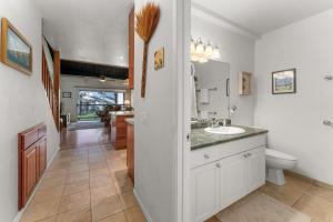 a bathroom with a sink and a toilet at Conveniently located two bedroom two bath HK319 in Wailea +34 photos
