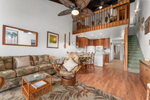 a living room with a couch and a table at Conveniently located two bedroom two bath HK319 in Wailea