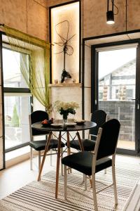 a dining room with a table and chairs at loft apartments OLD MILL in Sarny