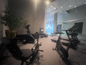 a gym with several exercise bikes in a room at Grand Hotel Times Levis in Lévis
