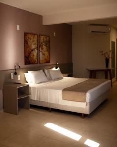 A bed or beds in a room at Bristol Infinity Rio Claro