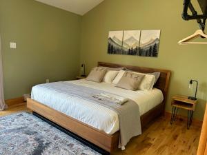 a bedroom with a large bed in a room at Tides Inn Guest Suites in Halls Harbour