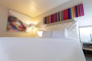 A bed or beds in a room at The Clarendon Hotel and Spa