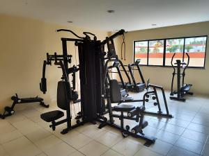 a gym with several tread machines in a room at Suíte Funcional Independente - Via Park Flat Service - Campos dos Goytacazes in Campos dos Goytacazes