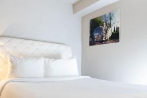 A bed or beds in a room at The Clarendon Hotel and Spa