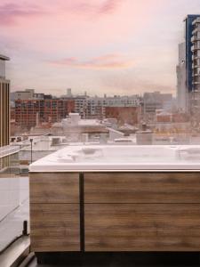 a bath tub on top of a building at Sonder Apollon in Montréal