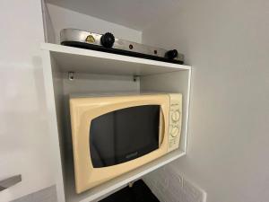 TV i/ili multimedijalni sistem u objektu Prático do residence