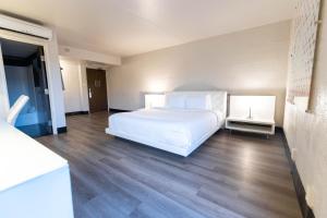 A bed or beds in a room at The Clarendon Hotel and Spa
