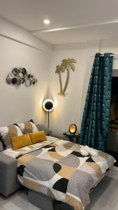 a bedroom with a bed and a palm tree on the wall at Studio NICE CENTRE sur Avenue Jean Medecin MER à 8 minutes de marche in Nice