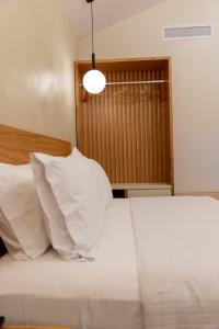 Postel nebo postele na pokoji v ubytování Elpis Guest House