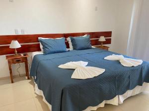 Un pat sau paturi într-o cameră la Pousada Alto da Serra