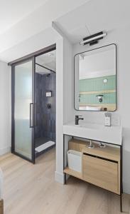 a bathroom with a sink and a mirror at Riverside Tower Hotel in New York