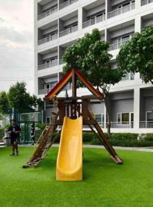 a playground in front of a building with a slide at LD Cozy 1BR Grace Residences, Taguig near BGC in Manila