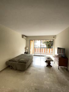 a bedroom with a large bed and a television at GuestRoom - Chambre d'hôte in Le Cannet +56 photos