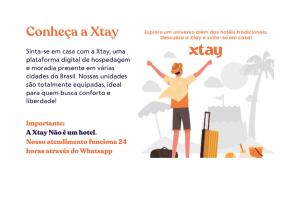a woman with her arms in the air with a suitcase and a vacation flyer at Xtay Soho Florianópolis in Florianópolis