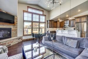 a living room with a couch and a fireplace at All-Season Heber City Condo with Stunning Views! in Heber City