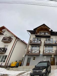 a car parked in front of a building at Haya Villa in Bukovel