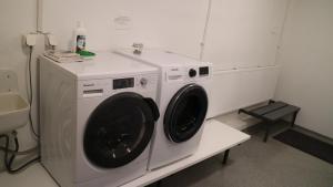 a white washer and dryer in a room at Tangahús Guesthouse in Borðeyri