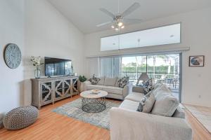 a living room with a couch and a table at Naples Vacation Rental Home with Heated Private Pool in Naples