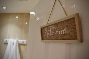 a bathroom sign on a shower in a bathroom at The Stuart Suite - spacious, affordable, city centre in York