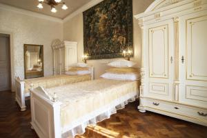 Posteľ alebo postele v izbe v ubytovaní Art Apartments Celakovskeho Sady