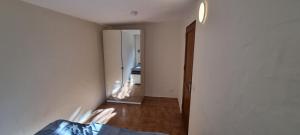 an empty room with a hallway leading to a bedroom at Casa Rural Anais in La Aldea de San Nicolas +40 photos