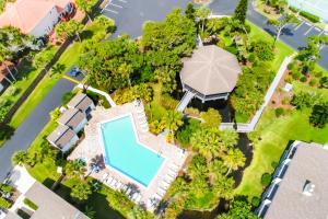 an overhead view of a house with a swimming pool and trees at Seawinds Oceanfront Condo in St. Augustine