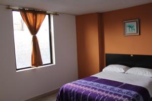 Postel nebo postele na pokoji v ubytování JULIUS Hostal