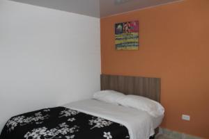 Postel nebo postele na pokoji v ubytování JULIUS Hostal