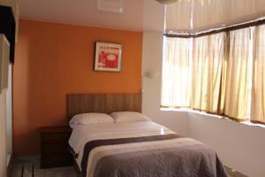 Postel nebo postele na pokoji v ubytování JULIUS Hostal