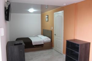Postel nebo postele na pokoji v ubytování JULIUS Hostal