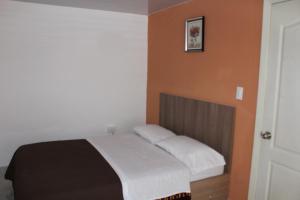 Postel nebo postele na pokoji v ubytování JULIUS Hostal