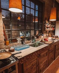 a kitchen with a sink and a counter top at Las Pircas, casa de campo in Ciudad Lujan de Cuyo