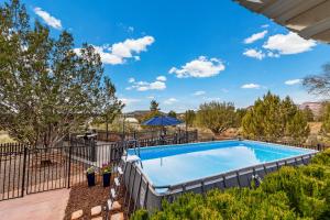 an image of a swimming pool in a yard at Serene Home- Sleeps 16 - Pet Friendly - Hot Tub - Pool in Sedona