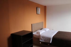Postel nebo postele na pokoji v ubytování JULIUS Hostal